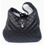 90's Vintage Burberry 'Brooke' Dark Brown Handbag. Quilted design, leather lock and key, gold-tone