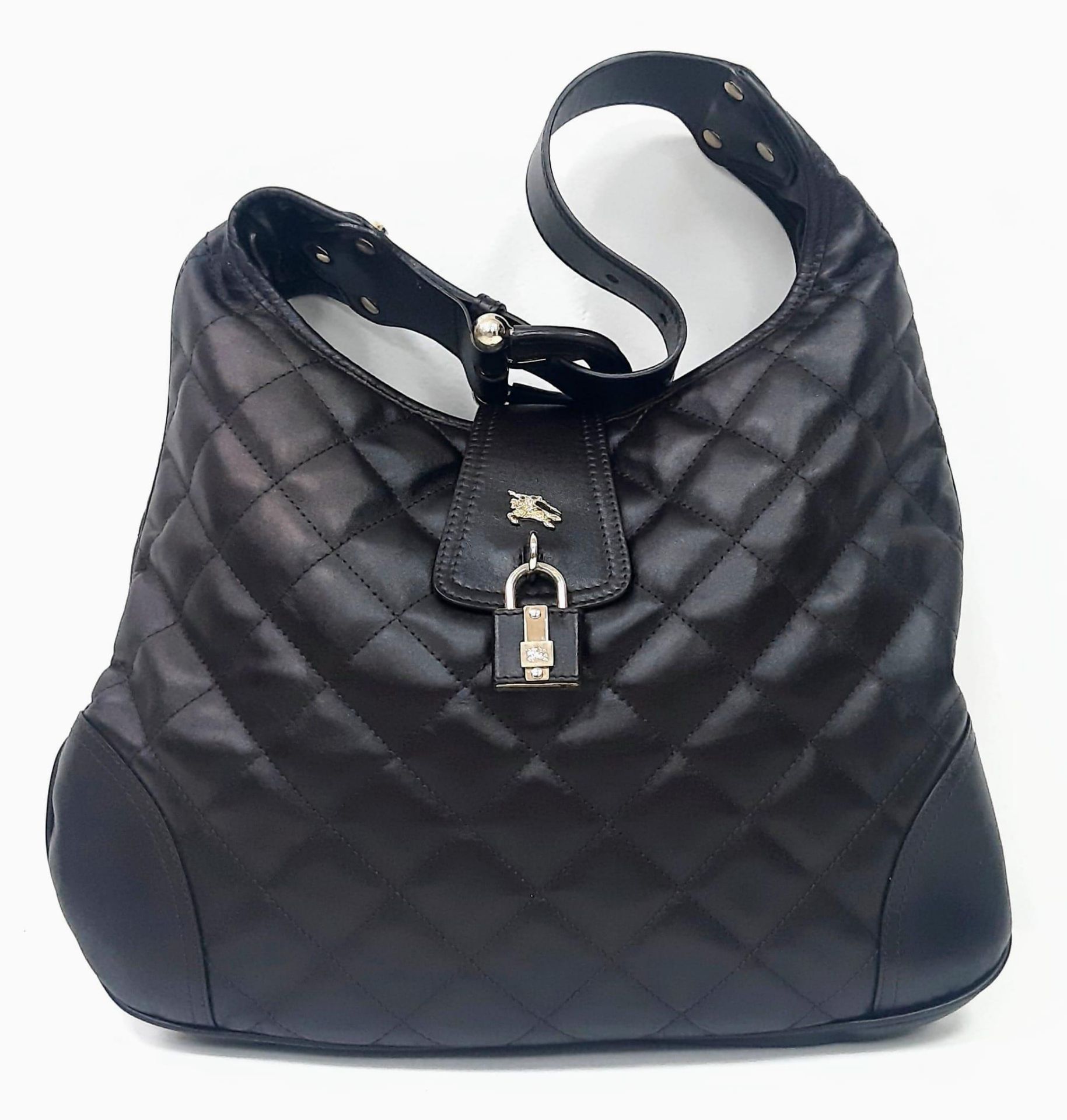 90's Vintage Burberry 'Brooke' Dark Brown Handbag. Quilted design, leather lock and key, gold-tone