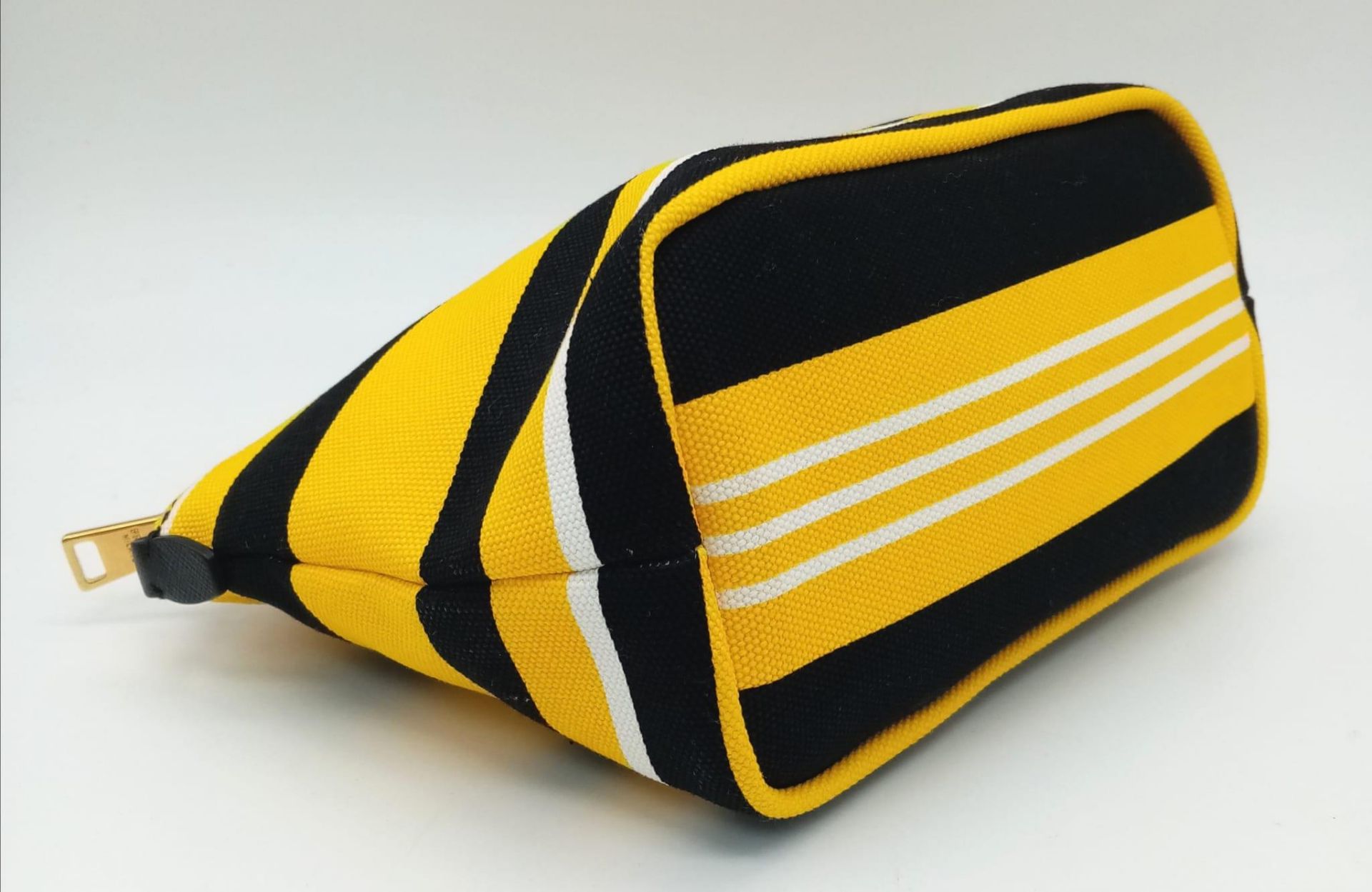 A Prada Yellow, Black and White Pouch. Textile exterior, with gold tone hardware and top zip, and - Image 5 of 13