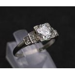 A Beautiful Vintage 18K White Gold and Platinum Diamond Ring. Central, quality 0.75ct brilliant
