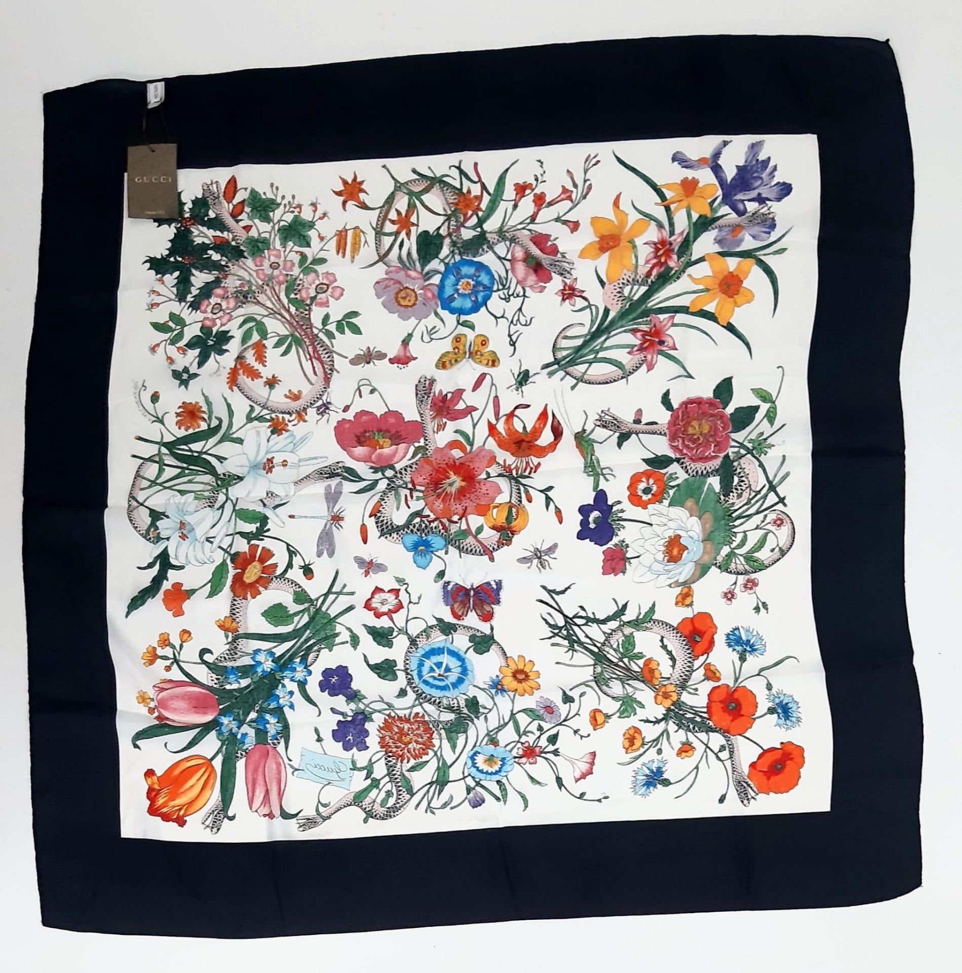 Gucci Silk Scarf. Features a wonderful floral & creatures pattern with a bold black border. Measures