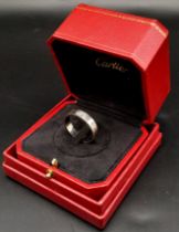 A CARTIER 18K WHITE GOLD GENTS RING IN ORIGINAL BOX WITH CARTIER AUTHENTICTY CERTIFICATE . 8.4gms