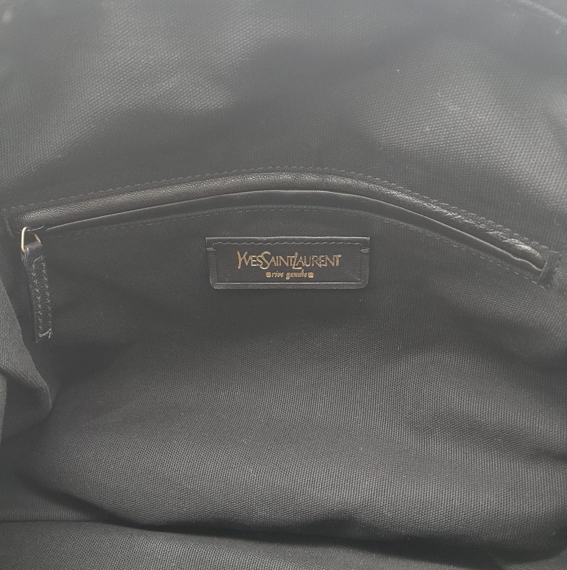 An Yves Saint Laurent Black Easy Bag. Leather exterior with gold hardware, double zipper, and 5 - Image 16 of 19