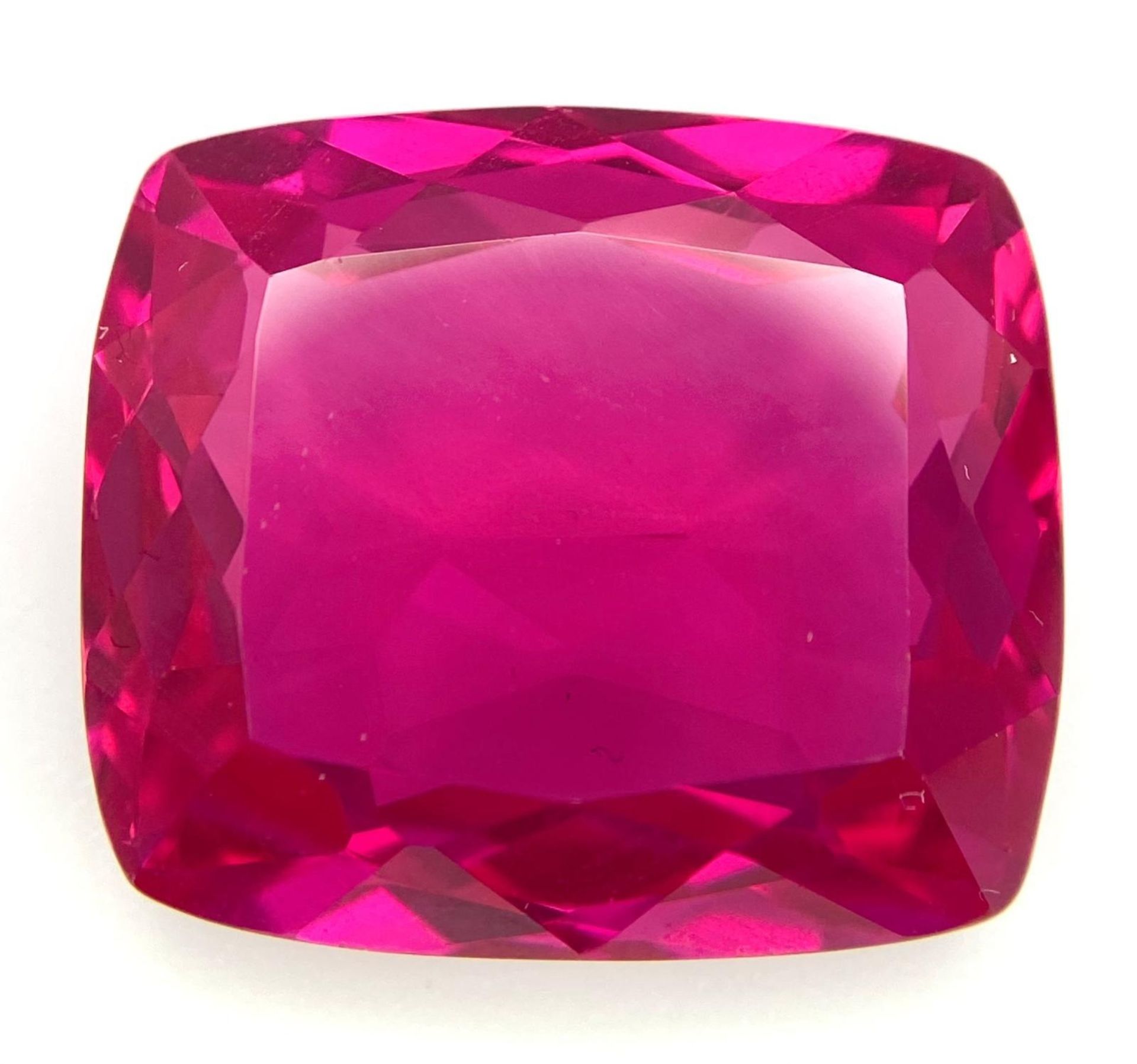 A fabulous, large (51.3 carats), RUBY. Cushion cut, exhibiting strong fluorescence under UV light,