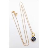 An 18K Gold and Enamel Evil Eye Pendant on an 18K Yellow Gold Disappearing Necklace.