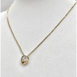 A DESIGNER WHITE AND YELLOW GOLD DIAMOND PENDANT ON A 40cme 14K GOLD CHAIN .4.25gms 009048