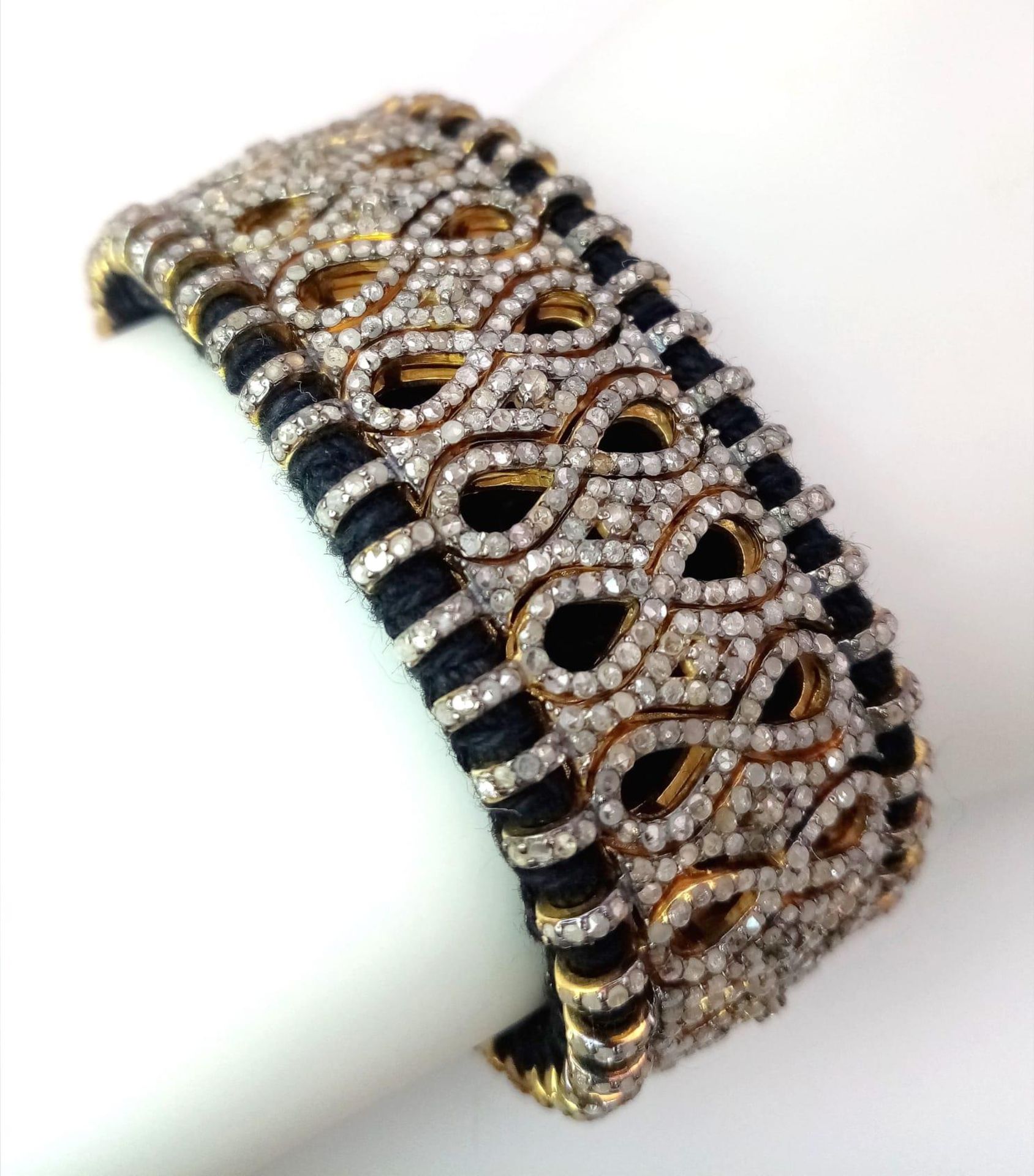 A Brilliantly Unique Handcrafted Designer Diamond Bracelet. A black woven textile bracelet strap