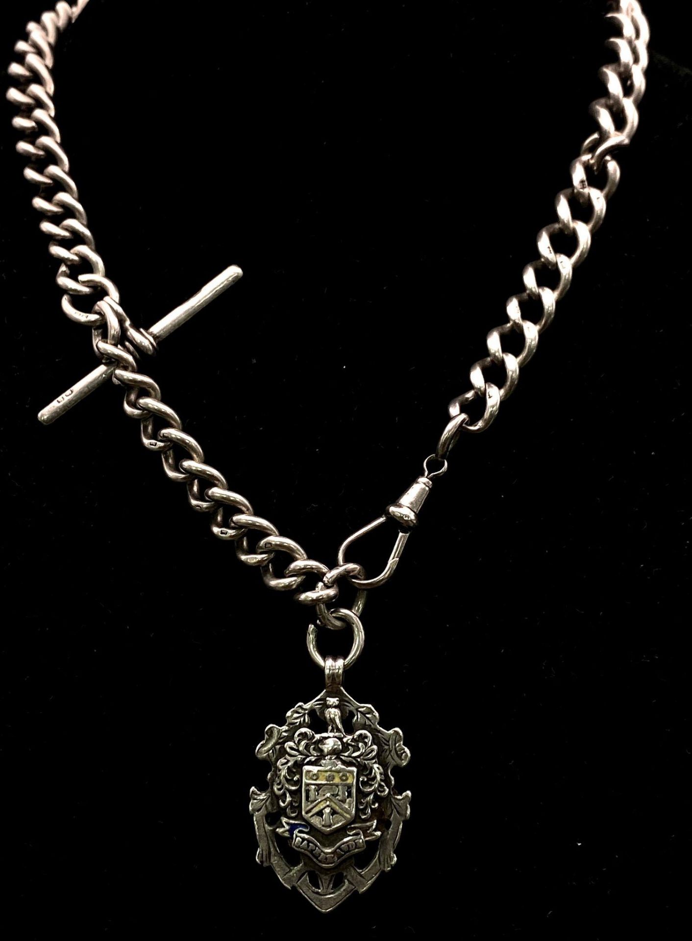 An Antique Sterling Silver Watch Chain with Fob. Hallmarks for Chester 1912. Makers mark of Robert