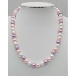 A Pearl Shell Necklace Consisting of Pink, White and Lavender Pearl Shells. 19mm diameter beads,