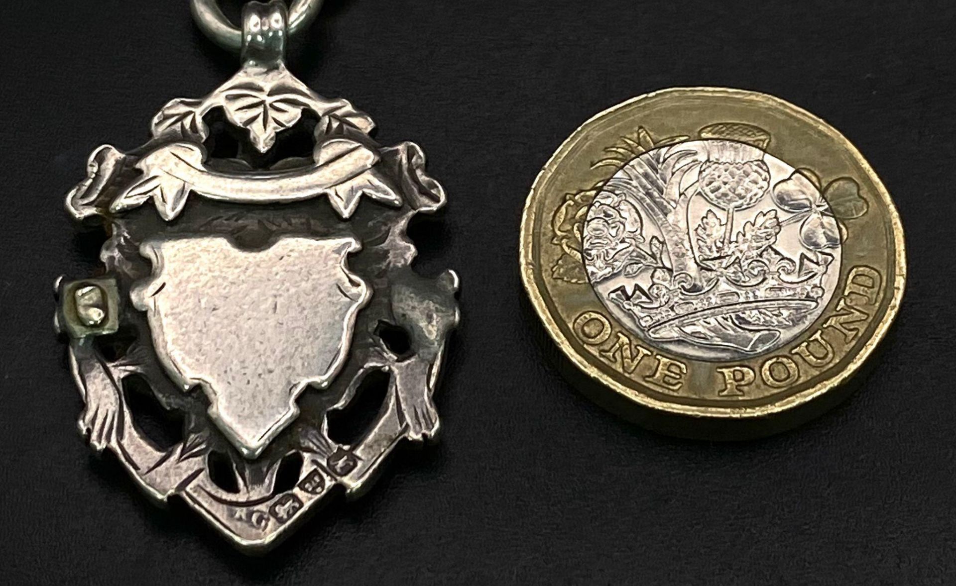 An Antique Sterling Silver Watch Chain with Fob. Hallmarks for Chester 1912. Makers mark of Robert - Image 4 of 8