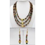 A three strand, multicoloured, multifaceted, Malaysian jade necklace and earrings set with Chinese