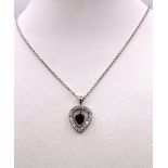 A VERY PRETTY SAPPHIRE AND DIAMOND PENDANT ON A 9K WHITE GOLD 45cms CHAIN . 6.4gms 13075