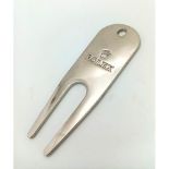 A Rolex Golf Divot Tool. Repair that putting green divot in style. Engraved white metal. As new.