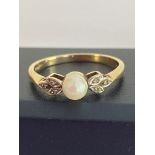9 carat GOLD RING with PEARL and DIAMOND detail. Full UK hallmark. Presented in a ring box.1.98