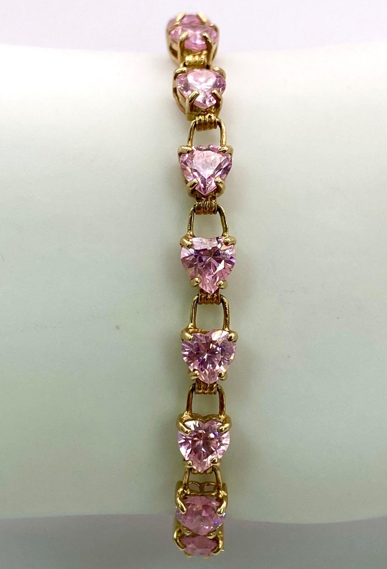 A 9K Yellow Gold Pink CZ Tennis Bracelet. 19cm. 8.86g total weight. - Image 2 of 5