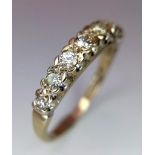 AN 18K GOLD RING WITH EIGHT GRADUATED DIAMONDS TO THE TOP . 3.1gms size O 13691