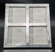 A Carrs Sterling Silver Four Picture Frame. 15cm x 15cm. In very good condition, in box.