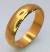 A 22K GOLD BAND RING . 6.5gms size O