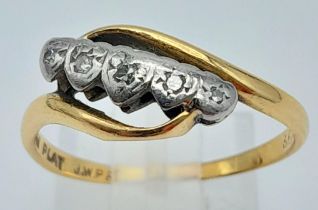 An Antique 18k Gold and Platinum Diamond Crossover Ring. Size M. 2.68g total weight.