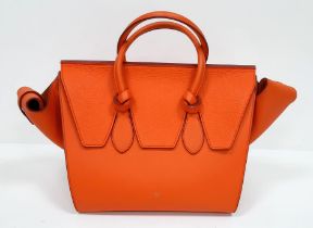 Celine Orange Tie Bag. Grained leather exterior, vibrant orange colouring. Made in Italy, it has a