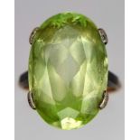 A Vintage 9K Yellow Gold Peridot Ring. 14ct faceted central peridot. Size Q. 5.12g total weight.