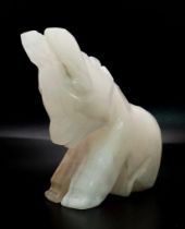 A lonely, hand-carved White Quartz Donkey figurine. Beautifully carved, the stone features