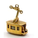 A 14K Yellow Gold Cable Car Pendant/Charm. 2cm. 4.2g total weight.