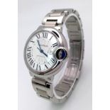 A CARTIER BALLON BLEU AUTOMATIC LADIES WATCH IN STAINLESS STEEL, VERY GOOD CONDITION WITH ROMAN
