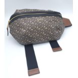 Burberry Canvas Bum Bag. 'B' monogrammed pattern with gold tone hardware. Main zip reveals sizable