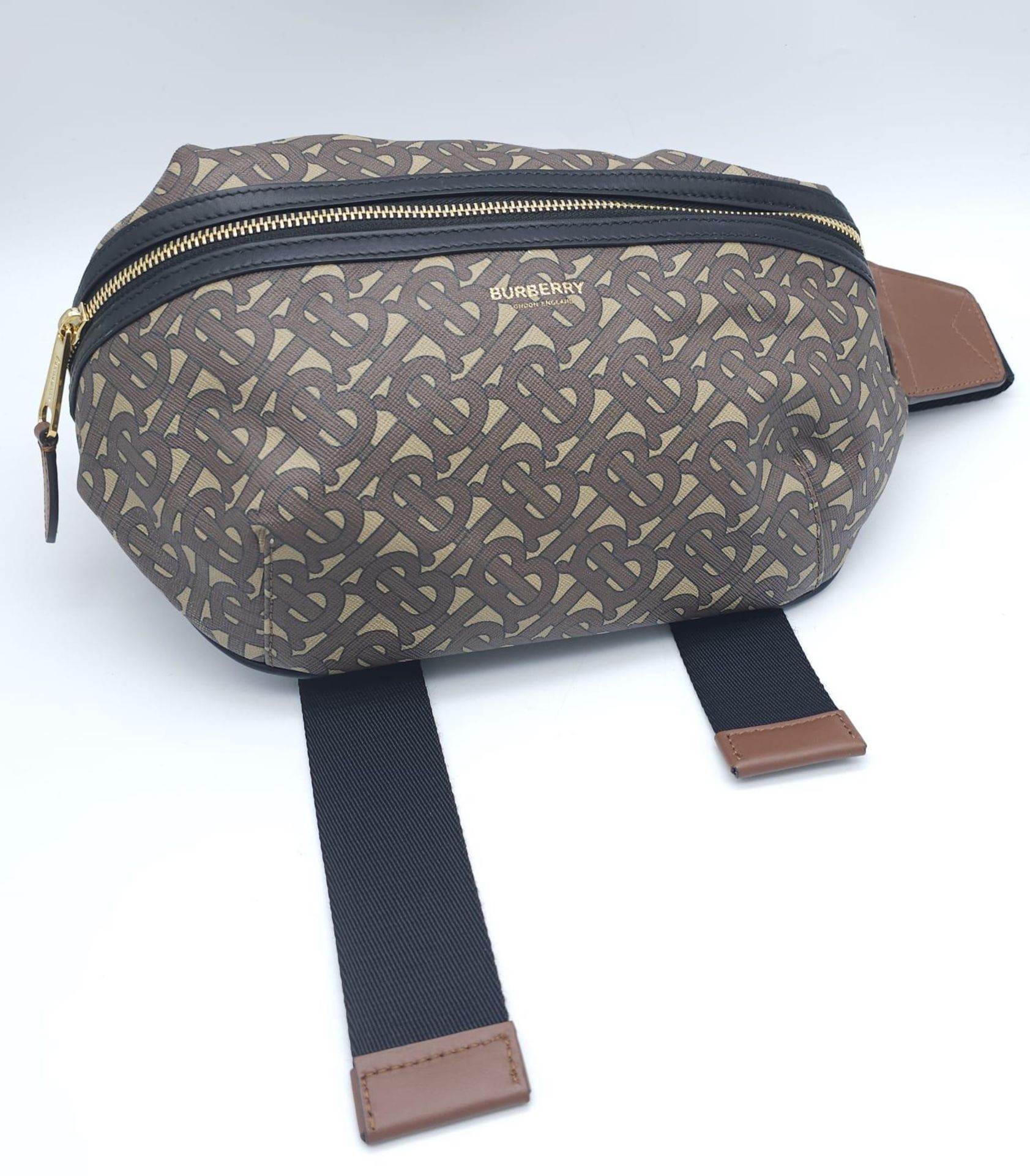 Burberry Canvas Bum Bag. 'B' monogrammed pattern with gold tone hardware. Main zip reveals sizable