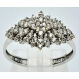 A 18K WHITE GOLD STONE SET CLUSTER RING IN THE FLORAL DESIGN 2.3G SIZE M/N ref: H 4001