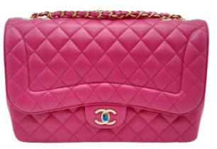 Chanel Mademoiselle Chic Flap Bag. Beautiful deep pink quilted lambskin leather with diamond