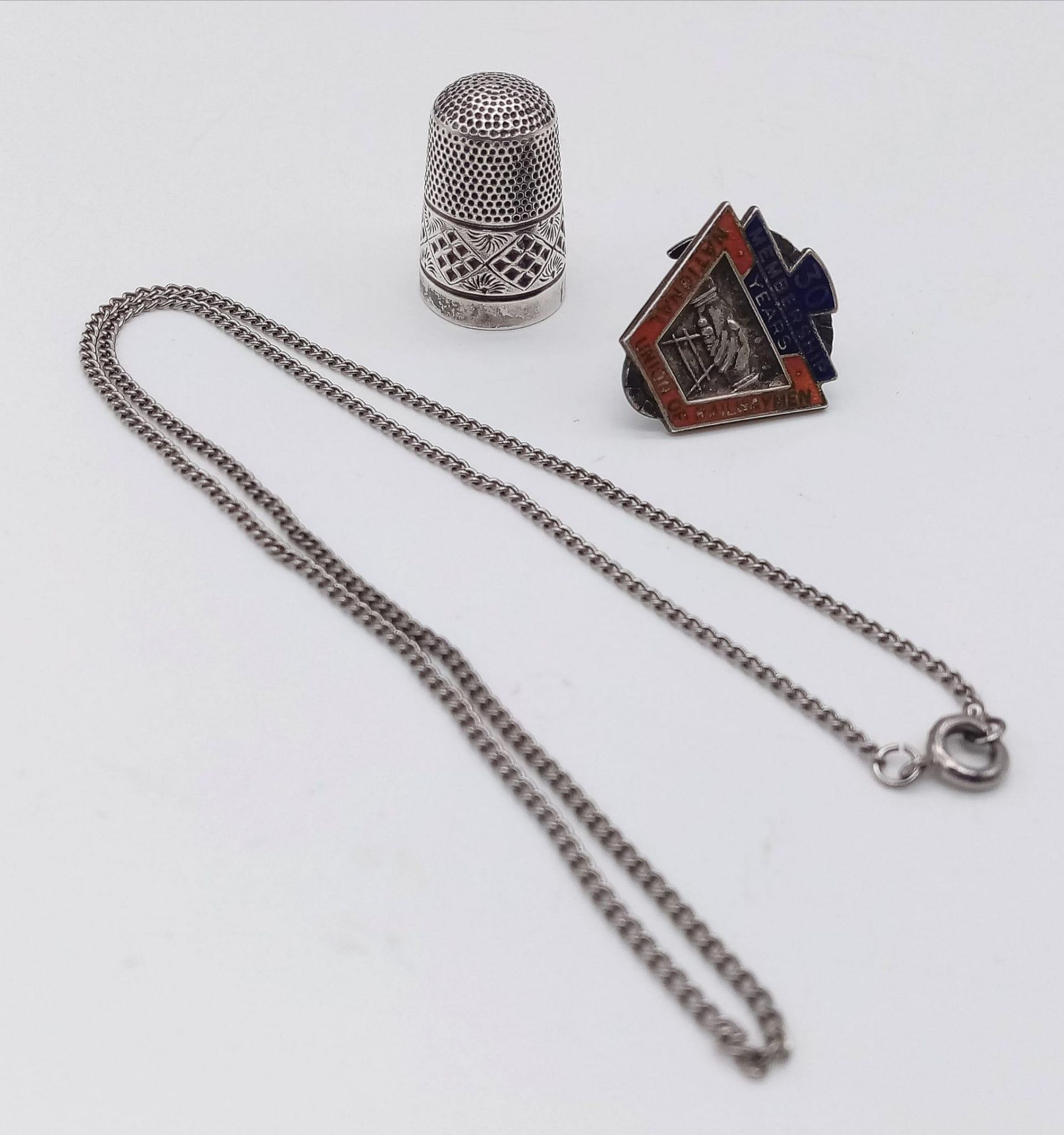 An Eclectic Vintage 925 Silver Mix: Railwayman Badge, Thimble and Necklace. 17g total weight.