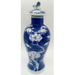 A Late 19th Century Chinese Blue and White Ceramic Lidded Vase. Floral decoration. Some damage,