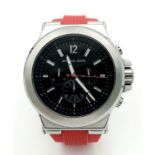 A Designer Michael Kors Chronograph Gents Watch. Red rubber strap. Stainless steel case - 49mm.