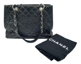 Black Chanel GST Bag. Quilted leather stitched in diamond pattern. Silver toned hardware and typical