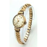 A Vintage 9K Gold Cased Ingersoll Ladies Watch. Rolled gold expandable bracelet. 9K gold case -