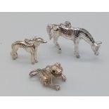 Three Sterling Silver Animal Charms - a horse, dog, and frog with gem set eyes. 12.2g total weight.
