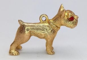 A Vintage 9K Yellow Gold Boxer Dog with Garnet Eyes Pendant/Charm. 25mm length. 4.96g weight.