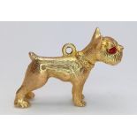 A Vintage 9K Yellow Gold Boxer Dog with Garnet Eyes Pendant/Charm. 25mm length. 4.96g weight.