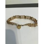 Vintage 9 carat yellow GOLD GATE BRACELET. Complete with GOLD safety chain. Full UK hallmark. 9