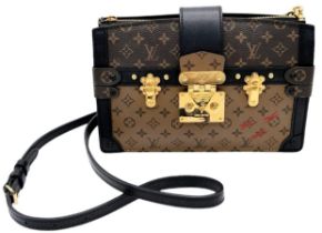 Louis Vuitton Pochette Trunk Crossbody Bag. Quality leather exterior with LV monogrammed exterior.