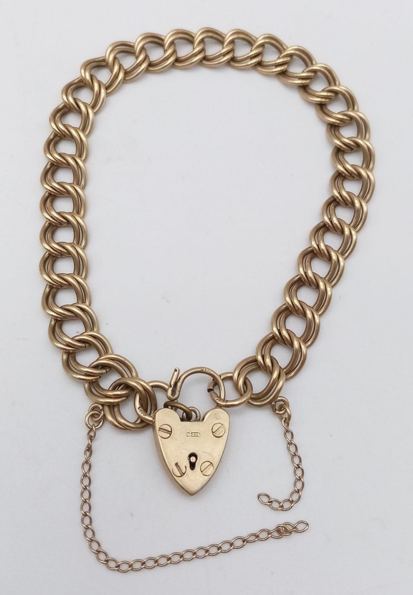 A Vintage 9K Yellow Gold Double Curb Link Bracelet with Heart Clasp. 17cm. 13.54g weight.