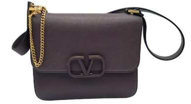 A Valentino Garavani VSLING shoulder Bag in Soft Burgundy Calfskin. Nappa Leather Interior With