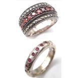 2X fancy 925 silver stone set rings. One with Garnet decoration, the other one is tripple row with