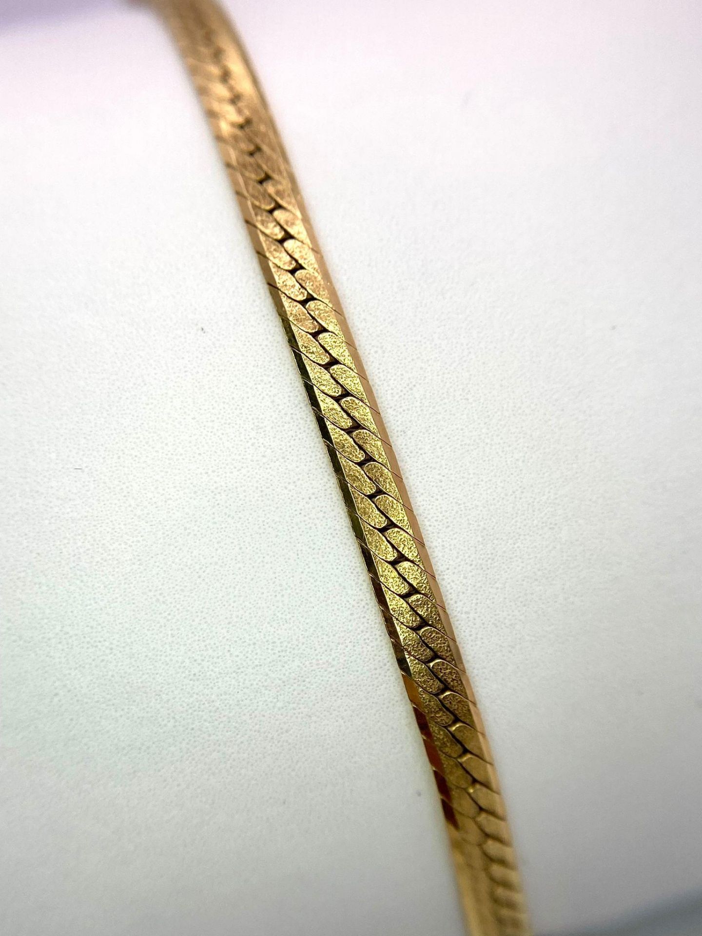 A 10k Yellow Gold Herringbone Bracelet. 17cm. 5g weight. - Image 3 of 4
