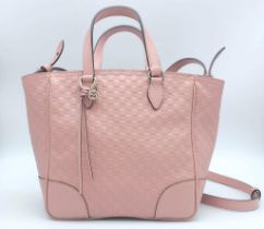 Pink Gucci Handbag. Striking colour with leather embossed monogrammed GG pattern. Duel top handles