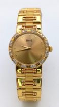 A STUNNING PIAGET 18K GOLD LADIES DRESS WATCH WITH DIAMOND BEZEL , QUARTZ MOVEMENT . GOLDTONE DIAL