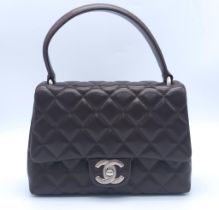 Chanel Flap Bag with Handle. Quality Lambskin leather, Diamond stitching with Silver tone