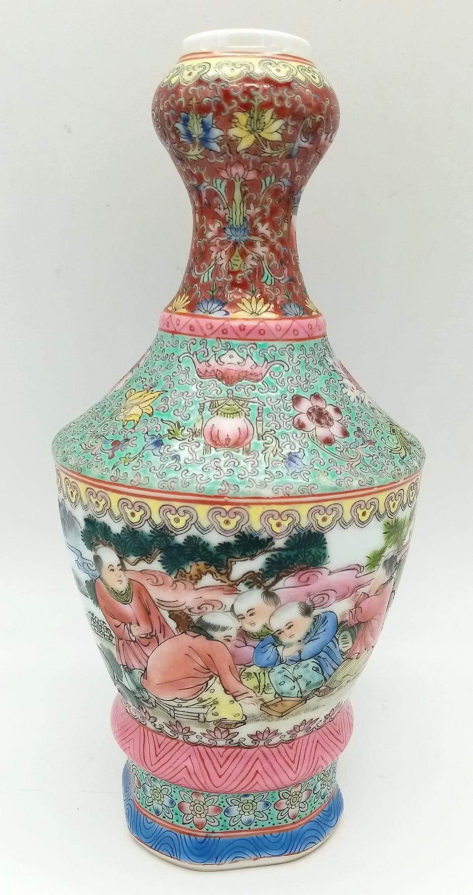 An Antique Chinese Vase. Beautiful hand-painted floral and people scene. Markings on base. 25cm